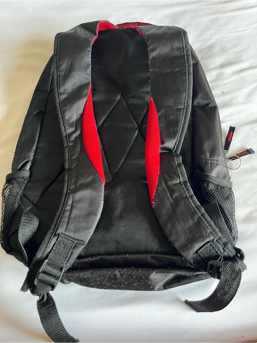 Black & Red Multi-Pocket Backpack with Media Port & Mesh Side Pockets